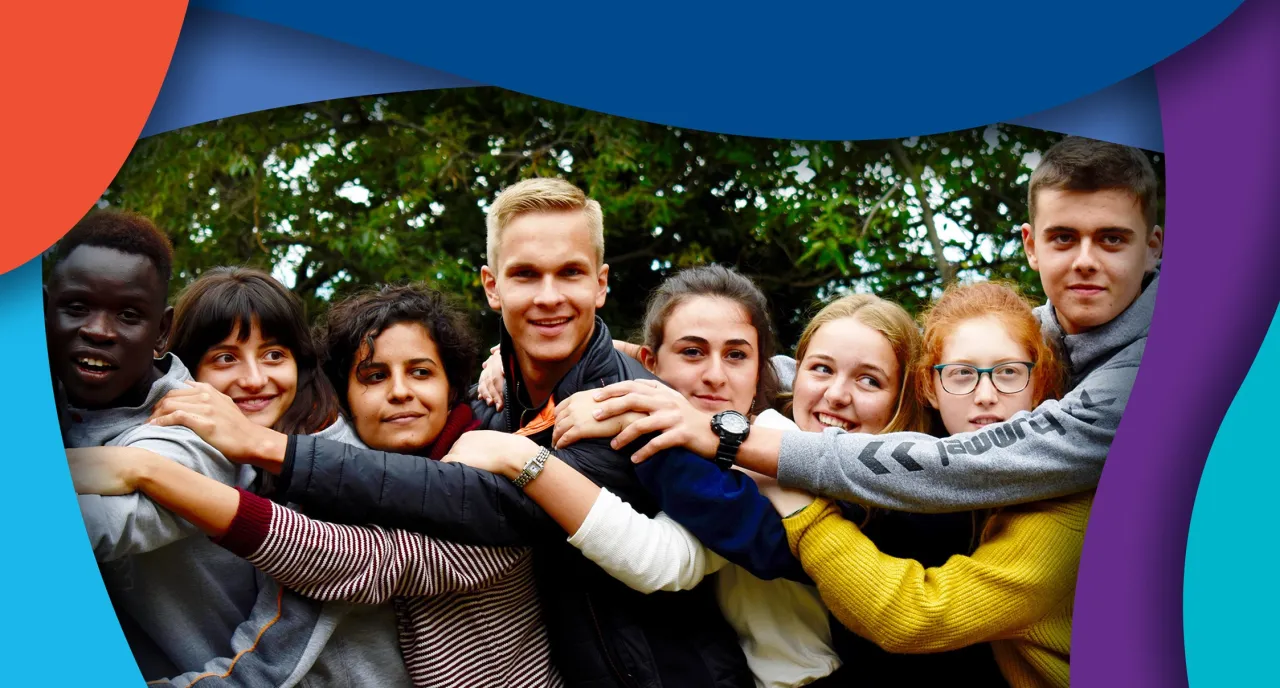 Students working together arm in arm